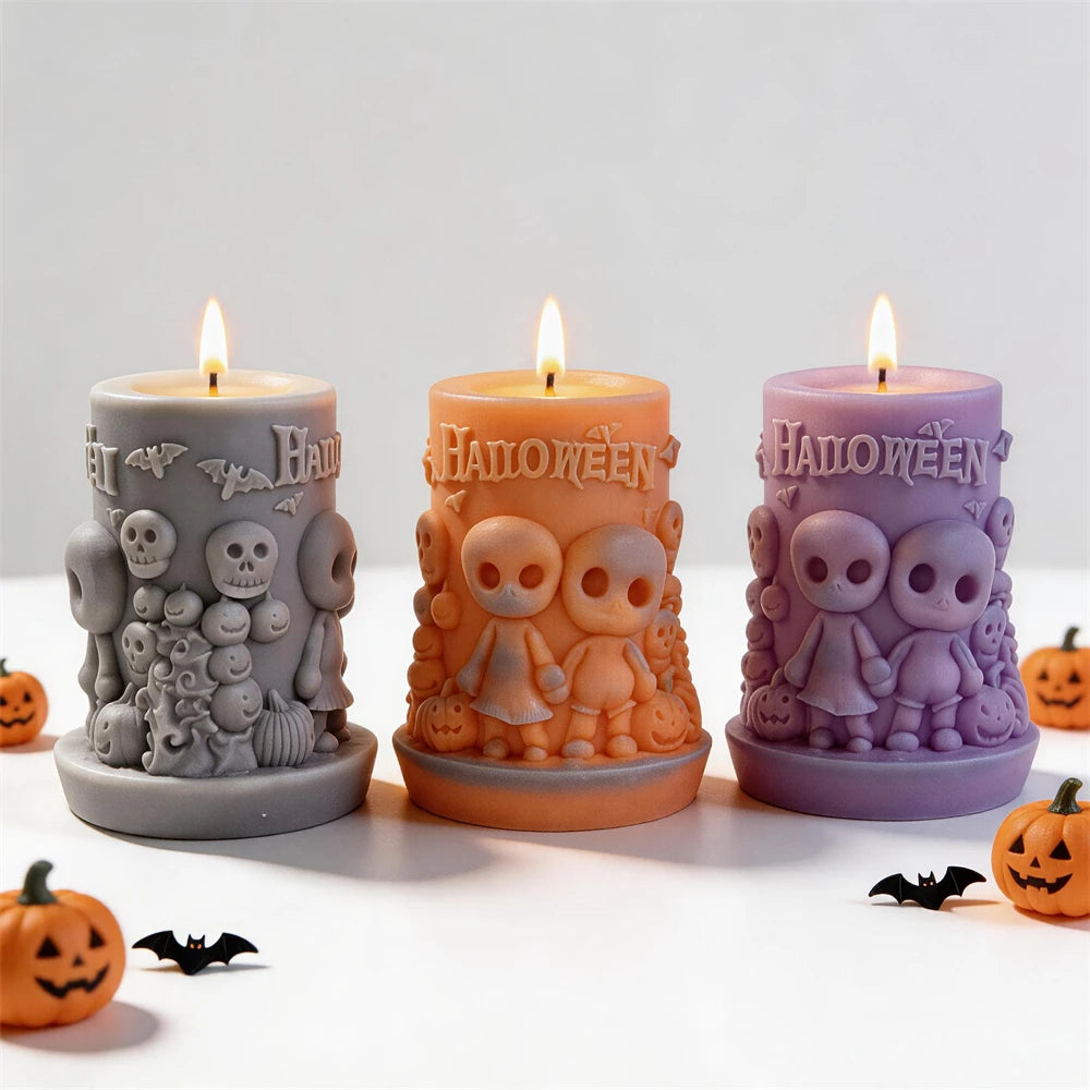 Gray, orange and purple Halloween scene pillar candle examples