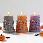 Gray, orange and purple Halloween scene pillar candle examples