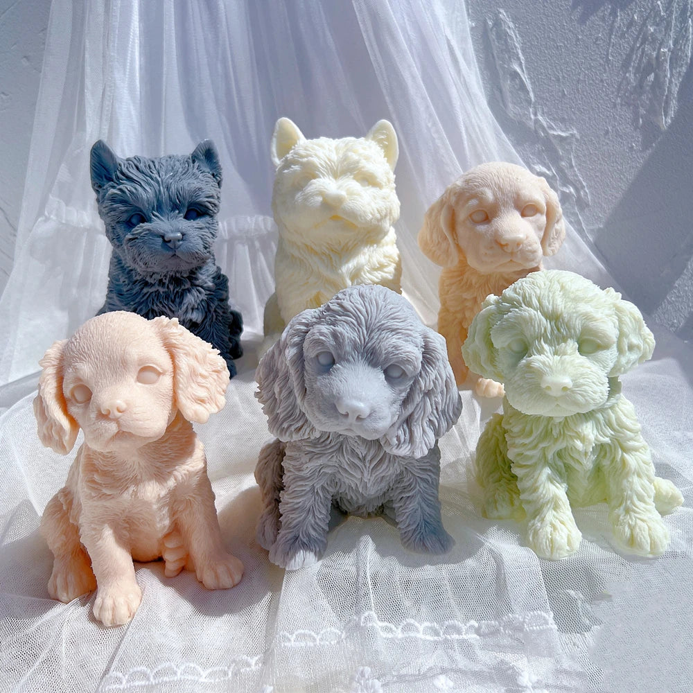 Close view of sculpted puppy faces, floppy ears and pointed ears