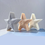 Gray, peach and cream textured star castings arranged together