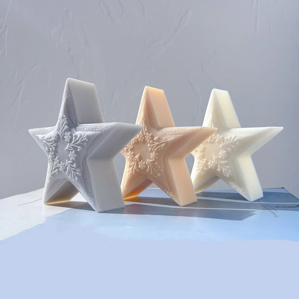 Gray, peach and cream textured star castings arranged together