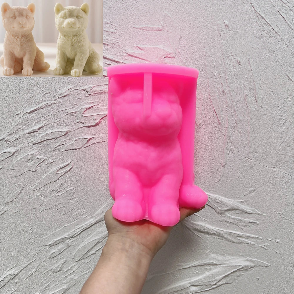 Pink Shiba Inu silicone candle mold held in one hand