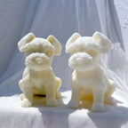 Two ivory schnauzer puppy candle castings with raised ears
