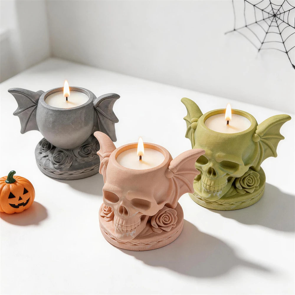 Gothic skull holders showing roses and patterned circular bases