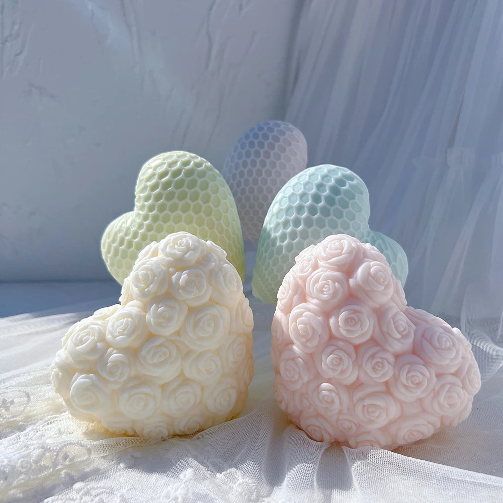Two rose-covered heart castings in front of honeycomb hearts