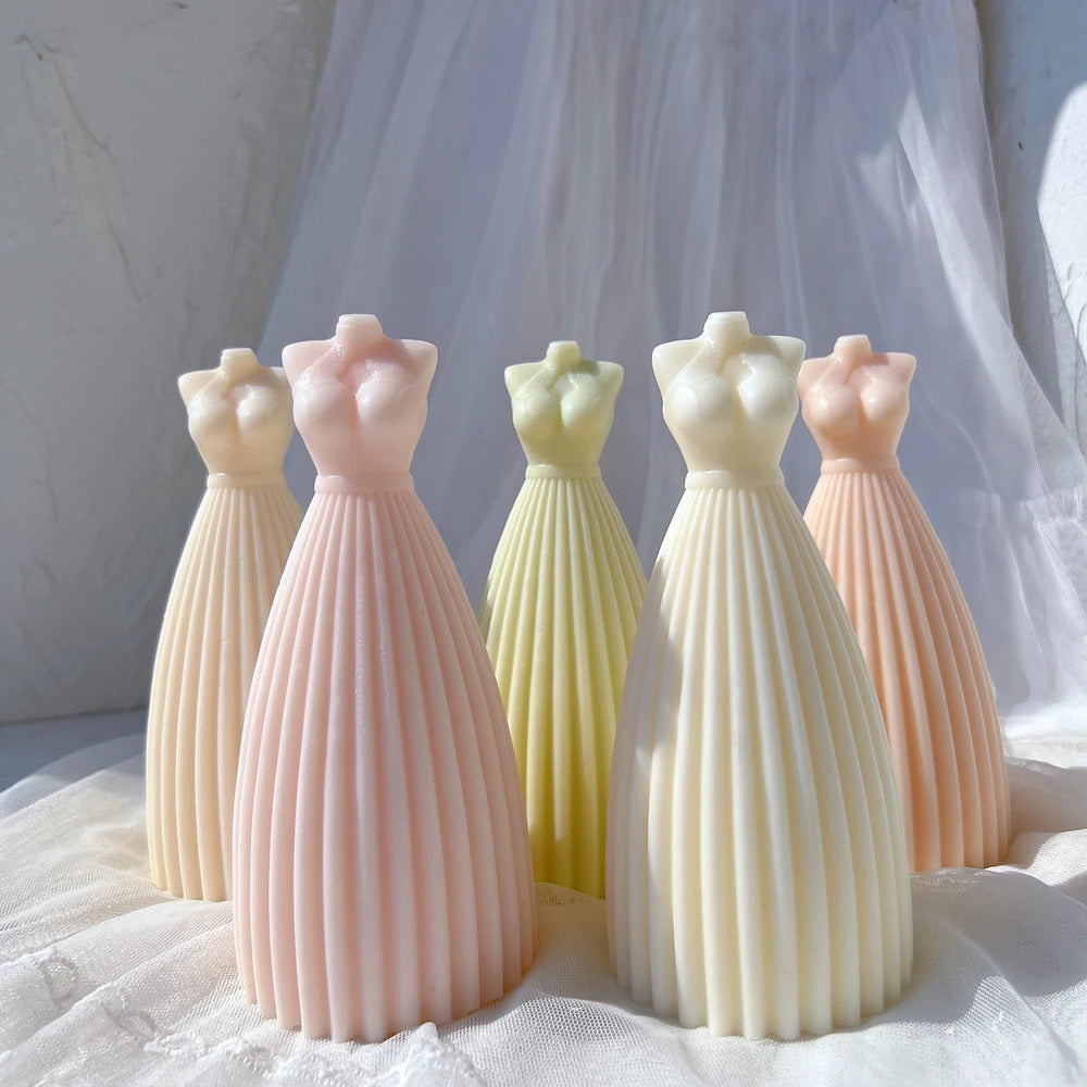 Group of long dress-shaped castings with vertical pleats