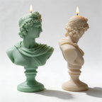 Side profiles of classical bust candles showing draped shoulders