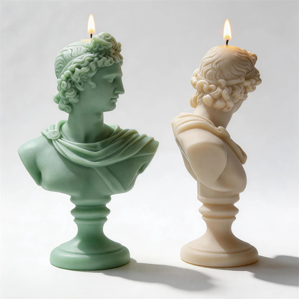 Side profiles of classical bust candles showing draped shoulders