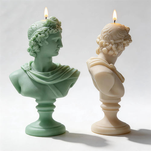 Side profiles of classical bust candles showing draped shoulders
