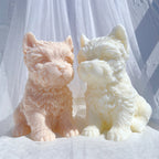 Front and three-quarter views of peach and cream terrier castings