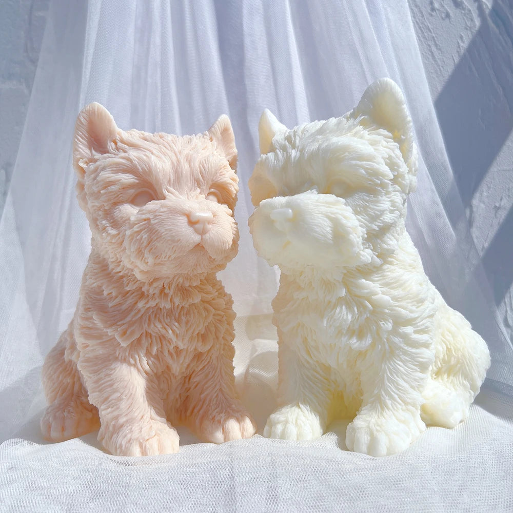Front and three-quarter views of peach and cream terrier castings