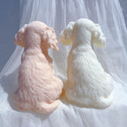 Back views of two puppy castings with fur texture and curled tails