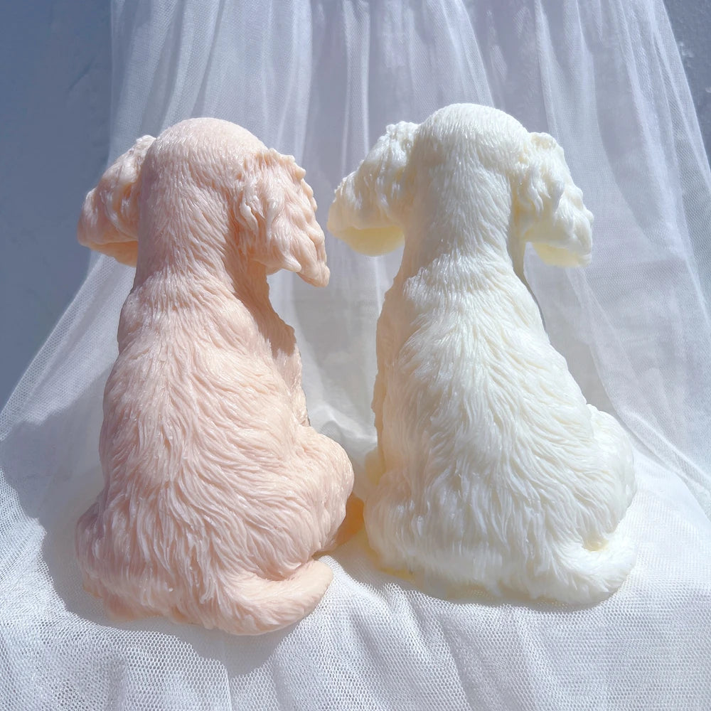 Back views of two puppy castings with fur texture and curled tails