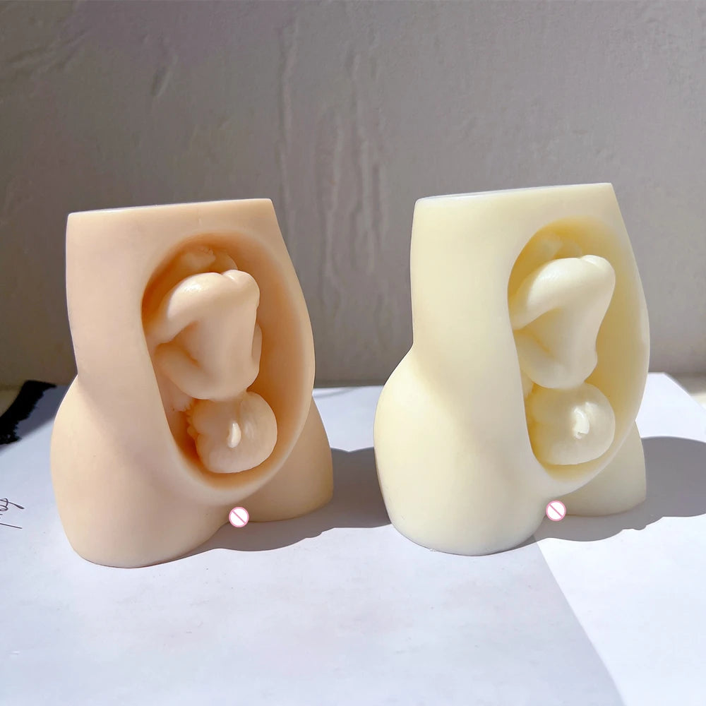 Peach and cream torso castings showing the baby detail