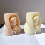 Peach and cream torso castings showing the baby detail