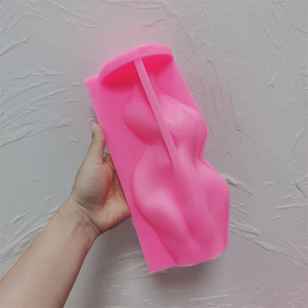 Pink silicone sculpture mold with a curving cavity