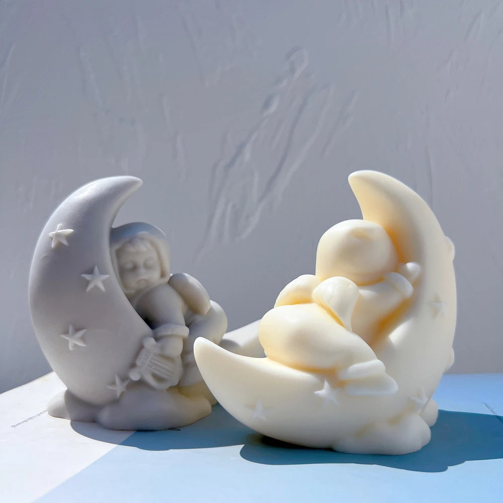Front and rear views of seated angel crescent sculptures