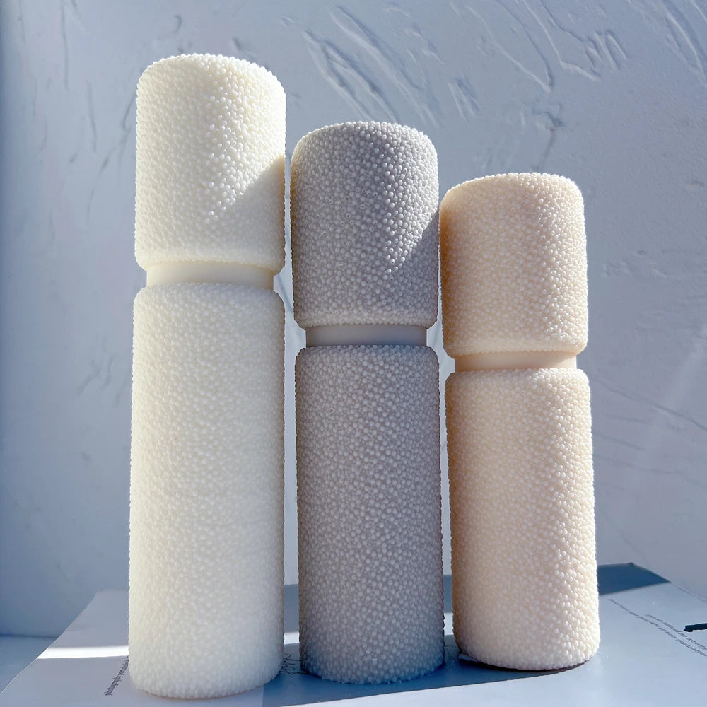 Three rounded pillar castings with narrow waist bands