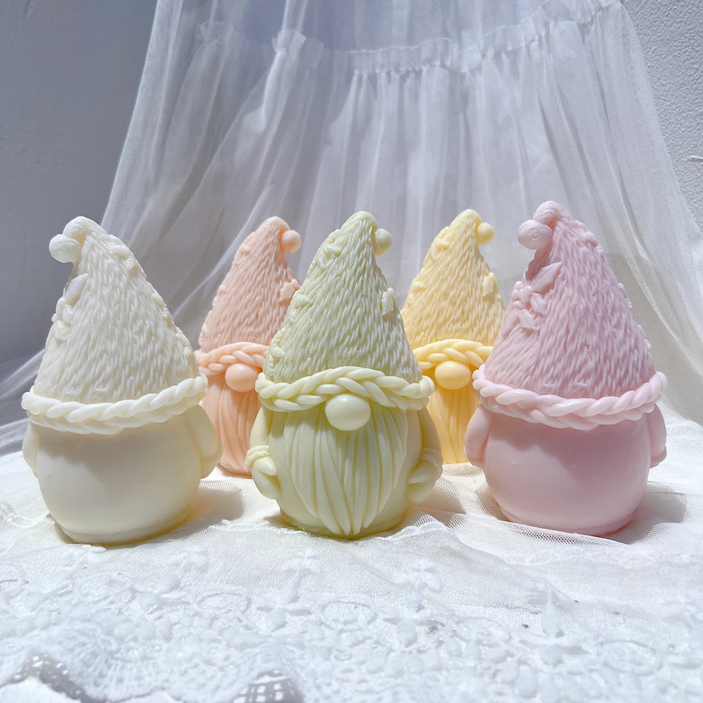 Rear of pink gnome beside front-facing knit-hat figures