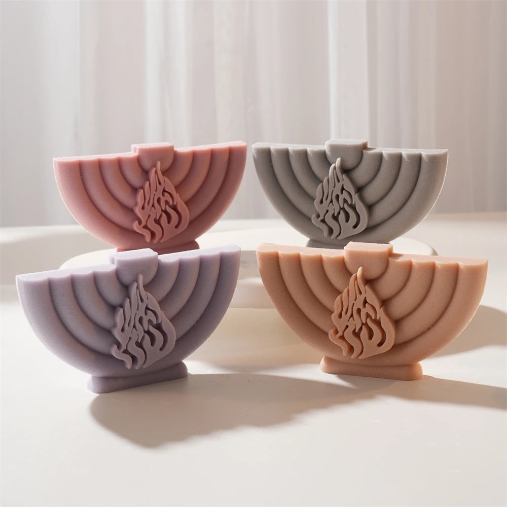Four menorah-shaped candle relief examples