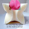 Pink mold detail and four-fan casting with a mold defect notice