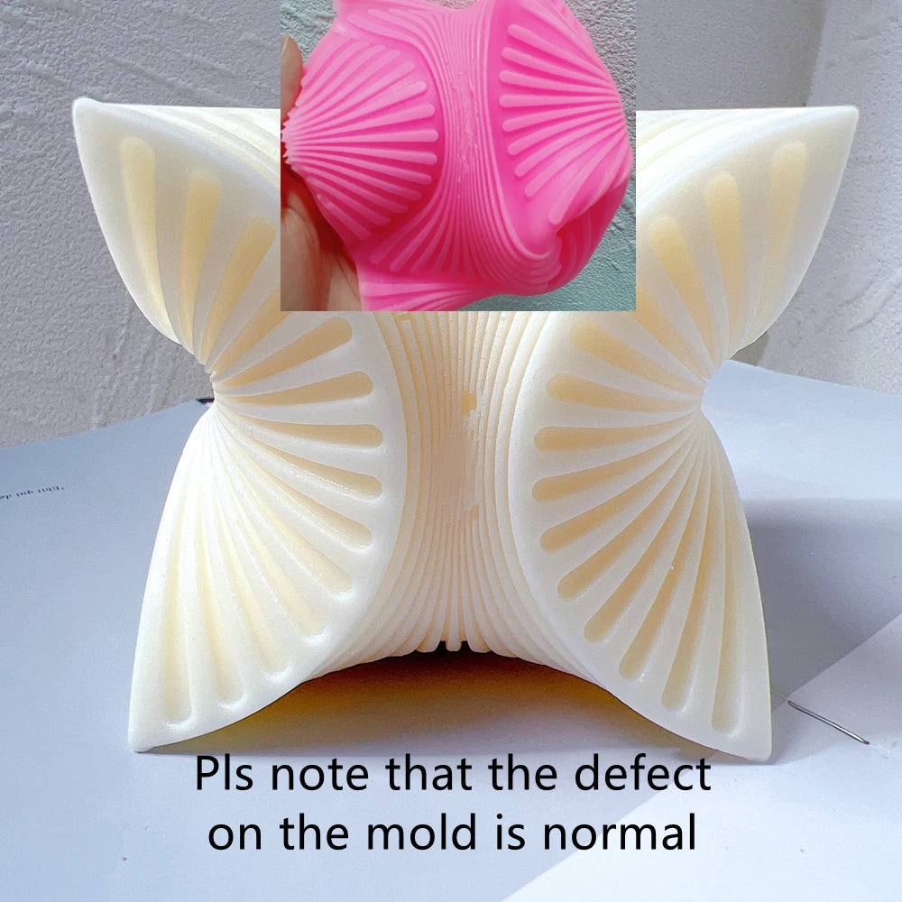 Pink mold detail and four-fan casting with a mold defect notice