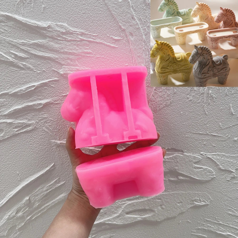Pink silicone mold used to cast the hollow ornate horse holder