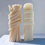 Front and rear views of a wrapped ribbon pillar showing contrasting surfaces