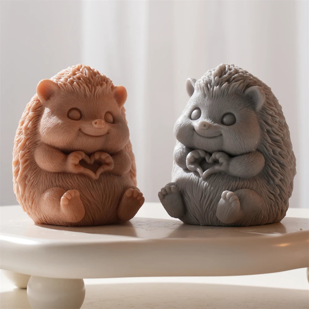 Two hedgehog castings showing smiling faces and rounded feet