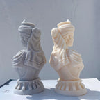 Profile and rear views of queen bust sculptures