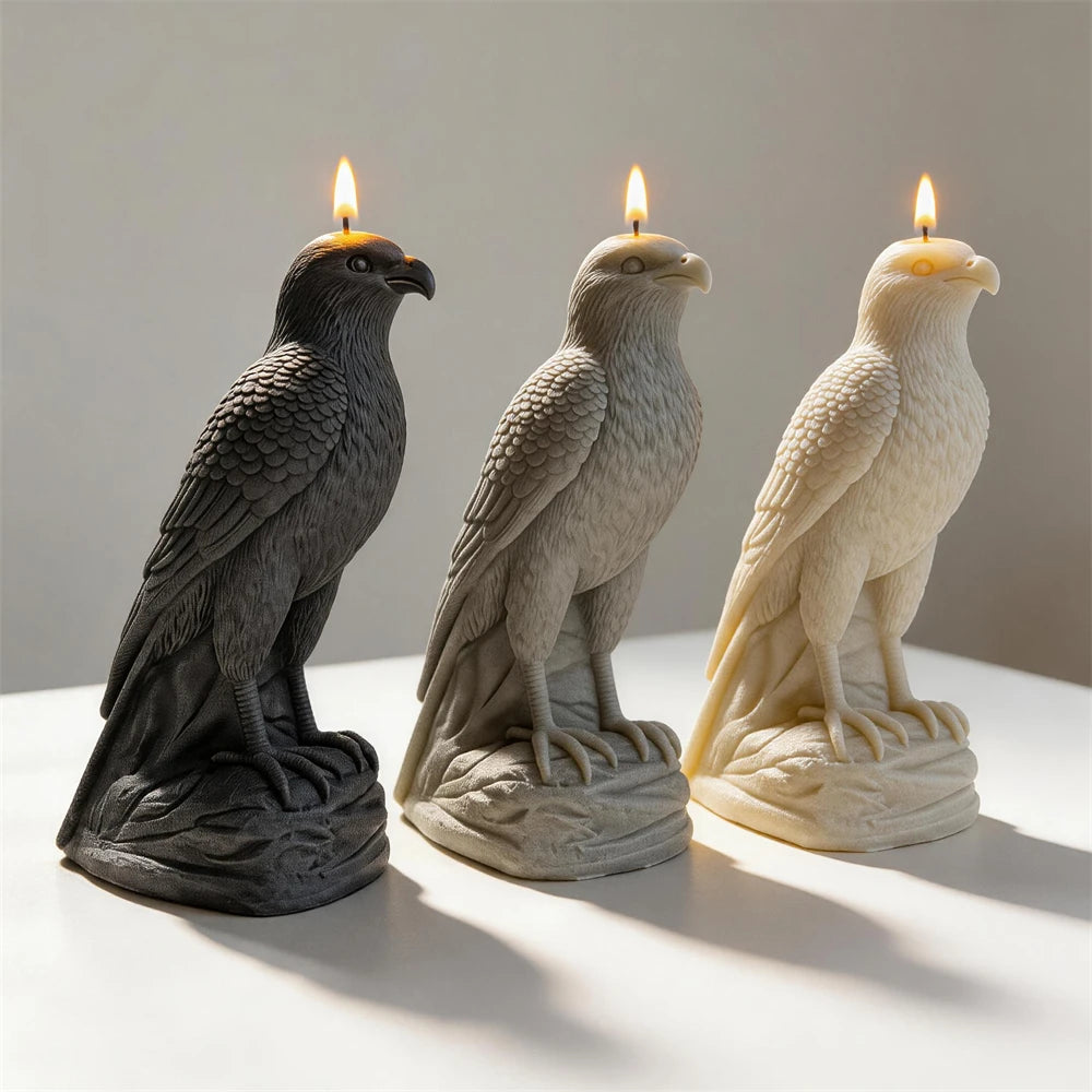 Three tall falcon castings with talons and layered wing feathers