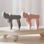 Side views of pink and gray Chai-inspired tealight holders
