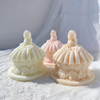 Three princess doll cake forms with wide skirts and rose borders