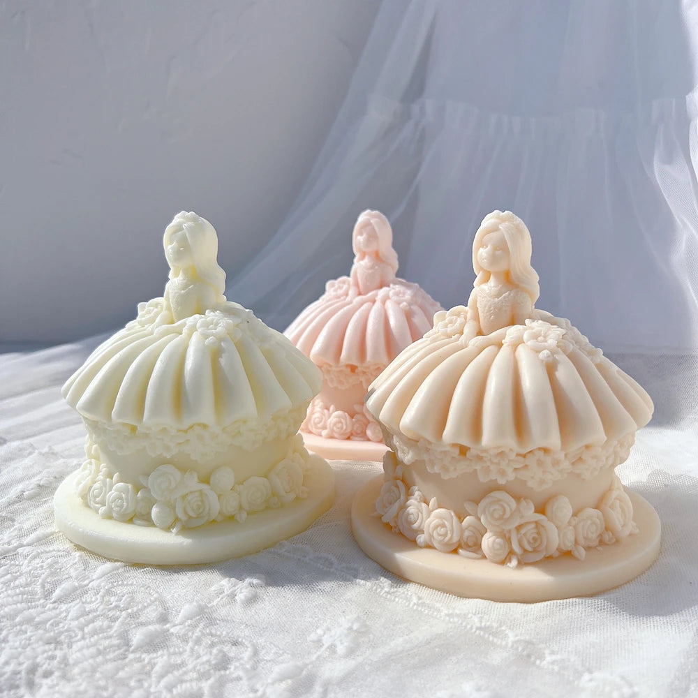 Three princess doll cake forms with wide skirts and rose borders