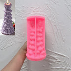 Pink silicone bell garland tree mold held open