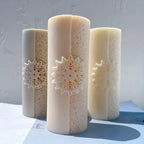 Cylindrical candles with floral mandala medallions and patterned bands