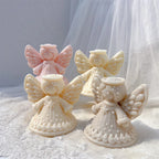 Grouped angel castings with scalloped dotted gown hems