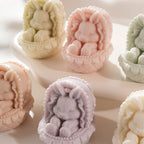 Close-up of sleeping rabbits and forward-facing paw pads