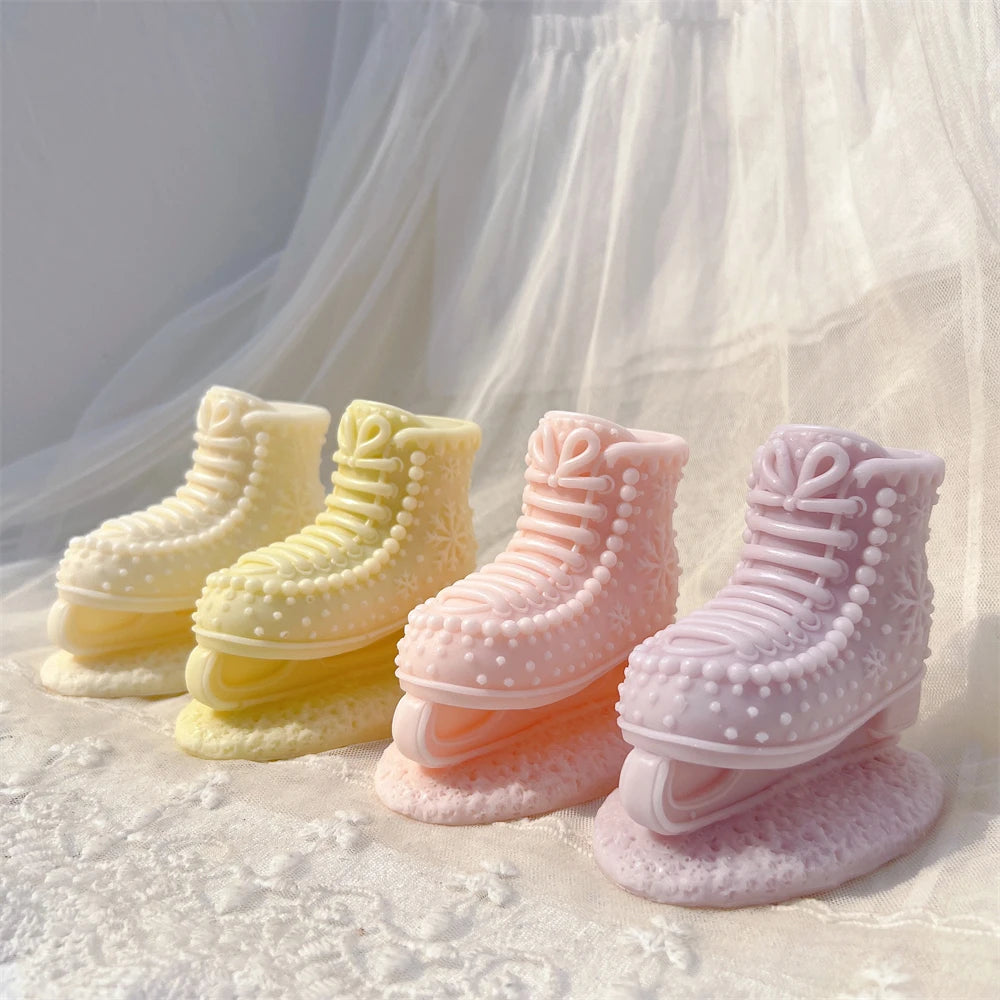 Four pastel ice skate boot candle castings from the same single mold design