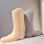 Cream and gray western boot candle castings with embossed shafts