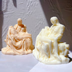 Peach and cream Pietà sculpture castings displayed together