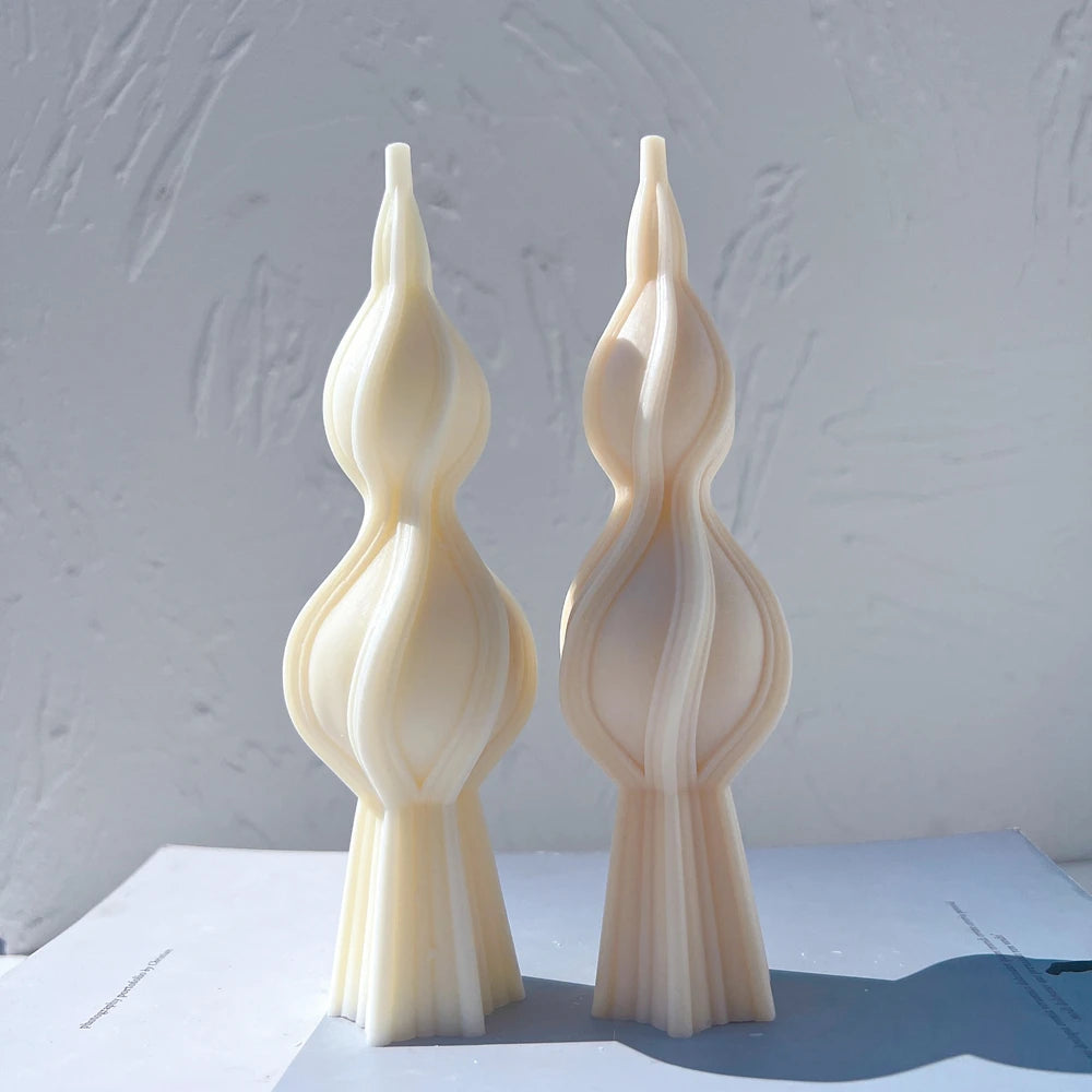 Two ribbed double-bulb spindle castings in sunlight