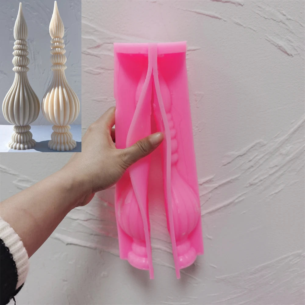 Pink silicone ribbed finial mold held open beside finished samples