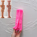 Pink silicone rabbit nutcracker mold opened along the figure cavity