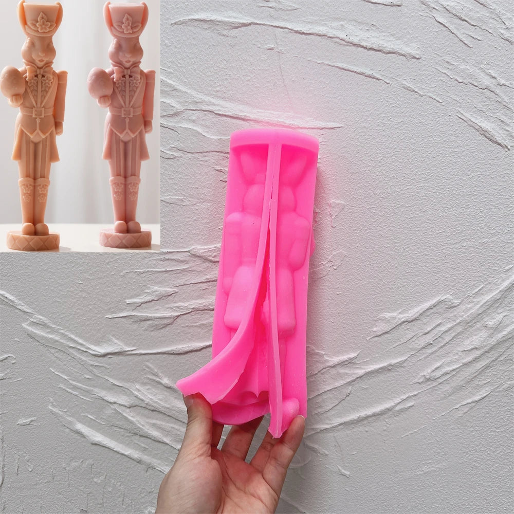 Pink silicone rabbit nutcracker mold opened along the figure cavity