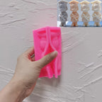 Pink boy graduate silicone mold held in one hand