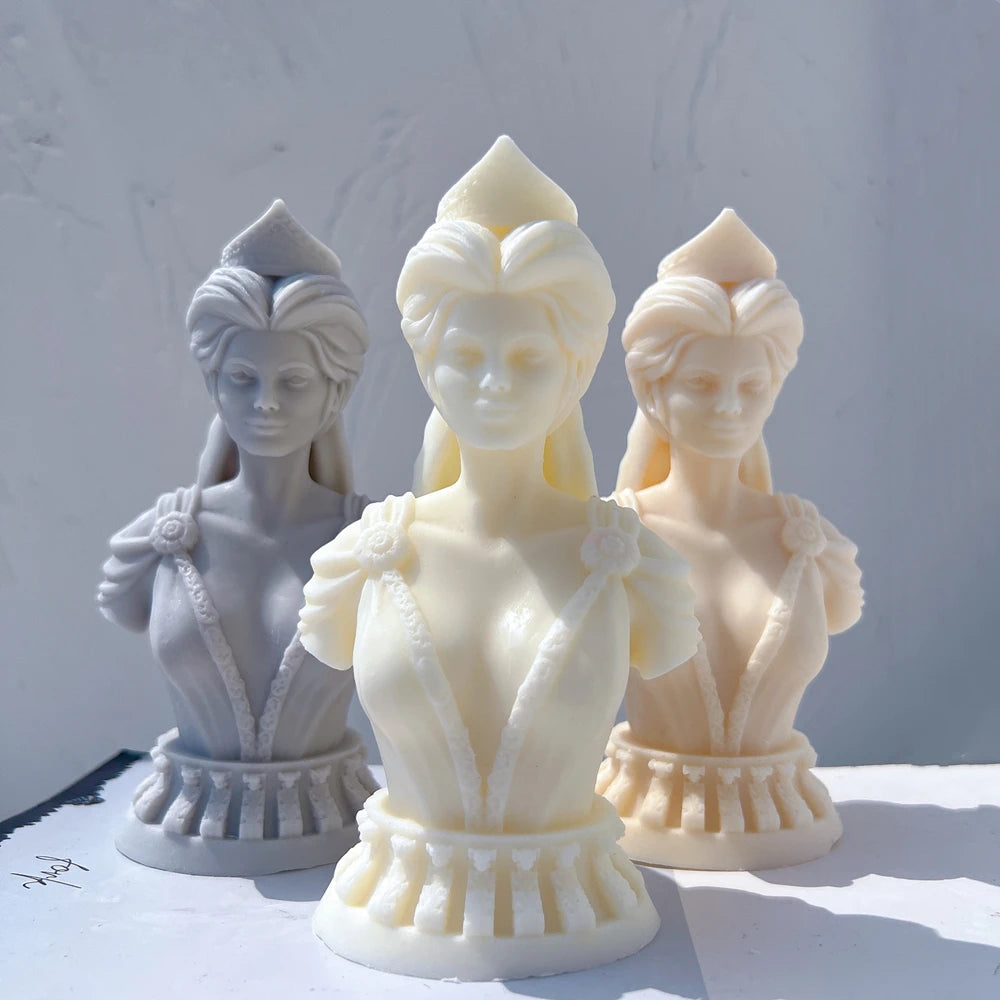 Three queen bust castings with flared bases