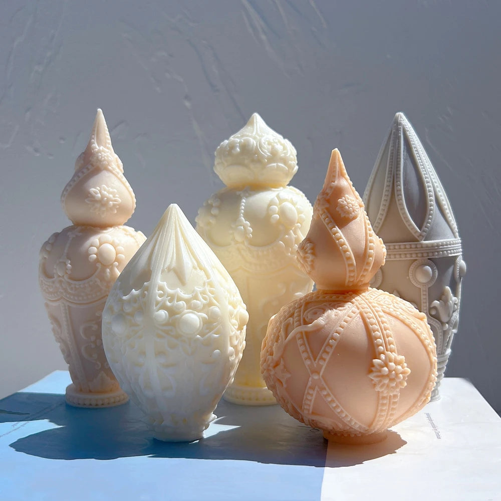 Ornamental casting group with floral teardrop, urn, beaded globe and ribbed spire designs
