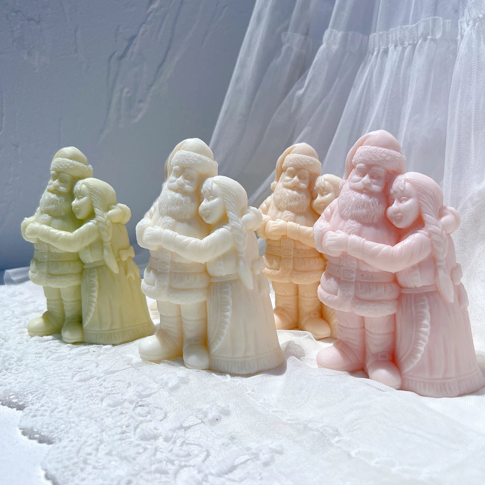 Embracing Santa couple figures standing together