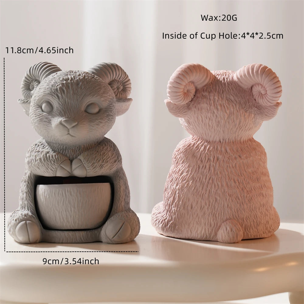 Seated ram holder casting with annotated 11.8 cm height and 9 cm base width